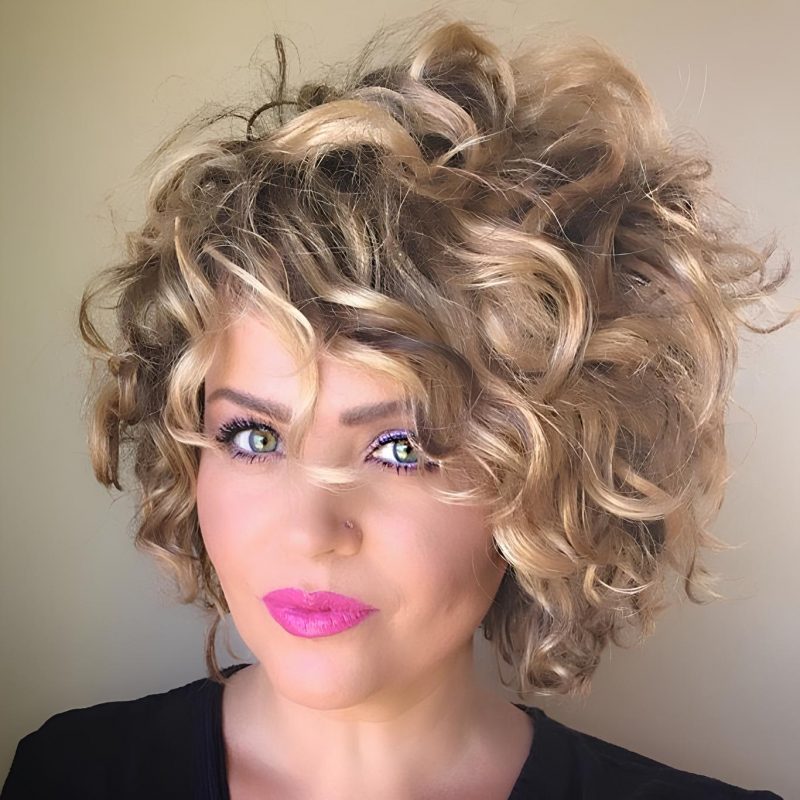 Blonde Voluminous Curls with a Glamorous Finish