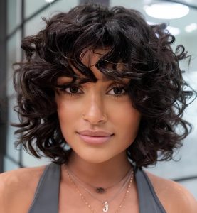 Natural Curls with Soft Bangs for a Romantic Look Natural Curls with Soft Bangs for a Romantic Look